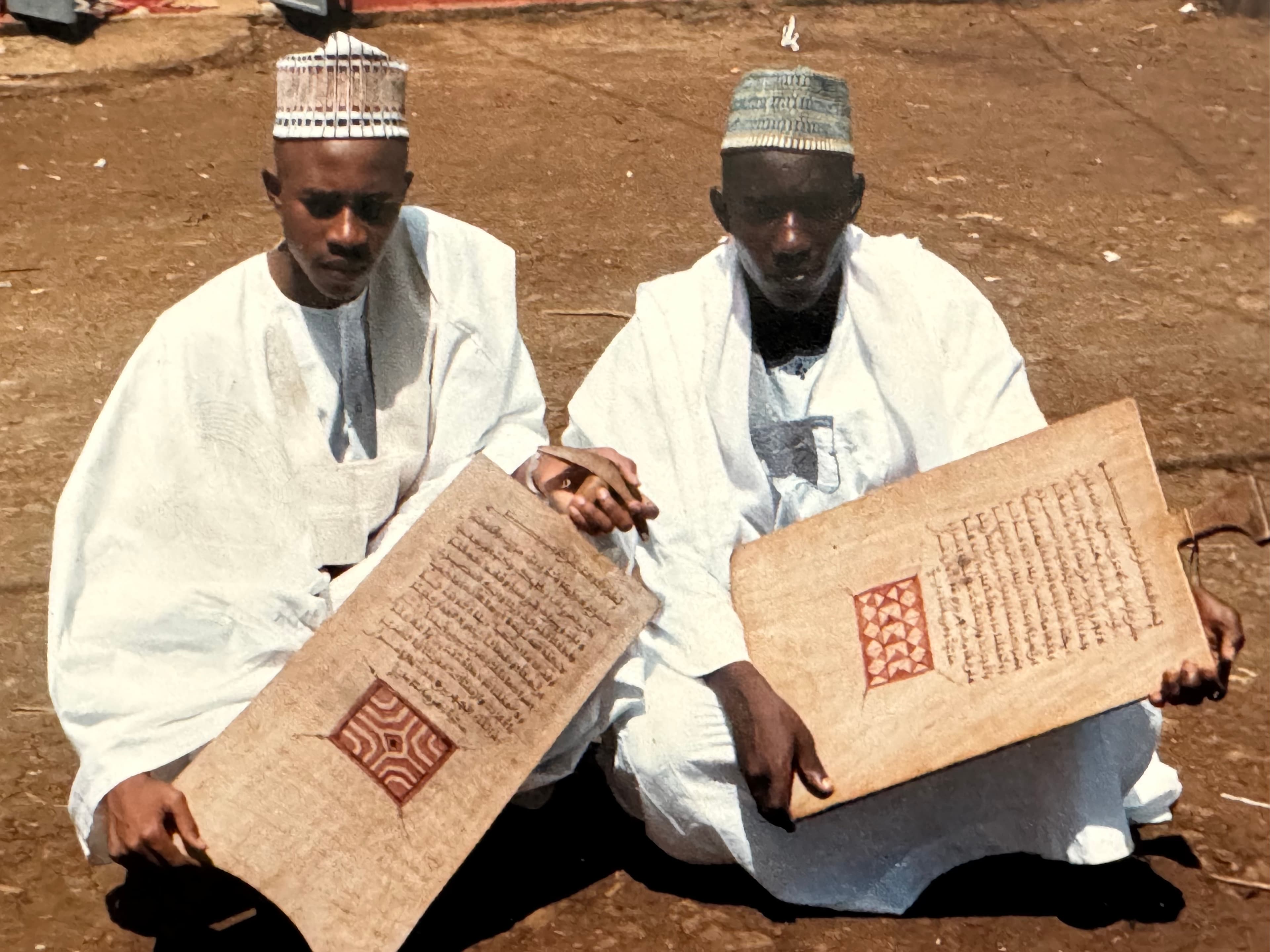 Mahamouda Salouhou with a Quranic manuscript during his Islamic scholarship